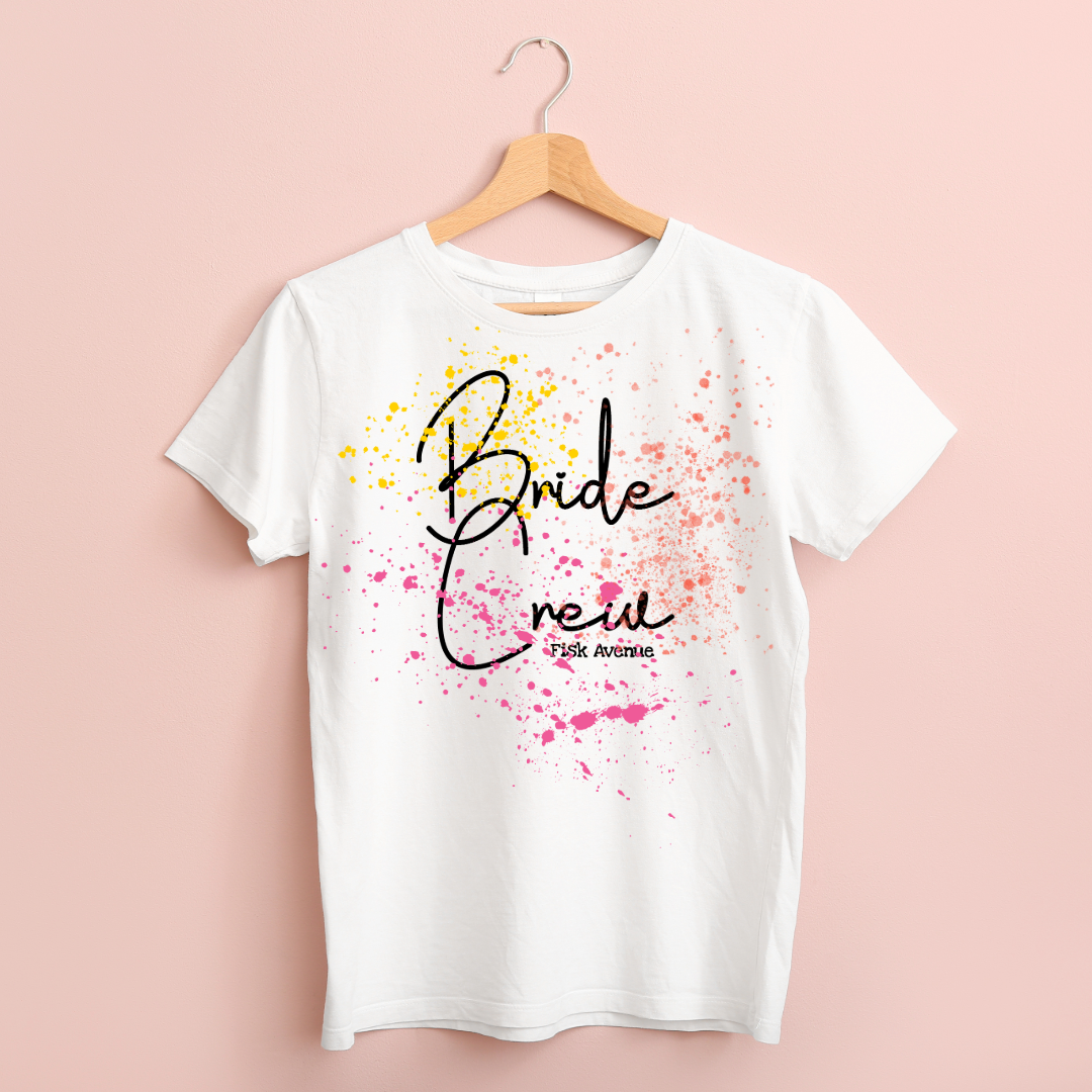 White t-shirt with 'Bride Crew Fisk Avenue' design on a pink background