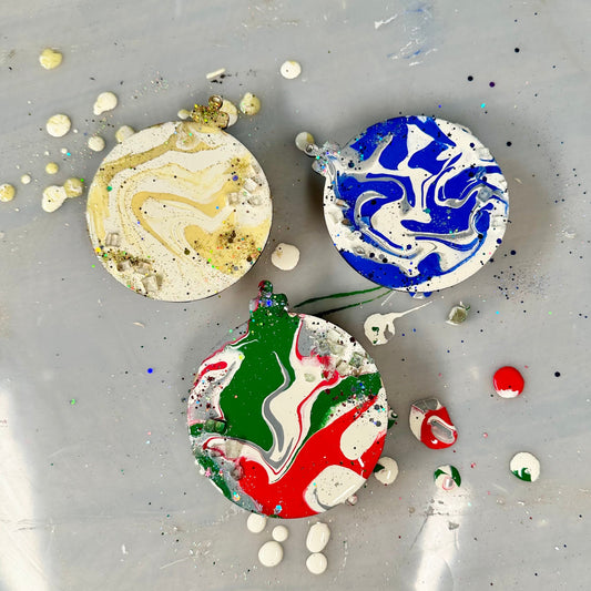 Colorful marbled ornaments on a tray