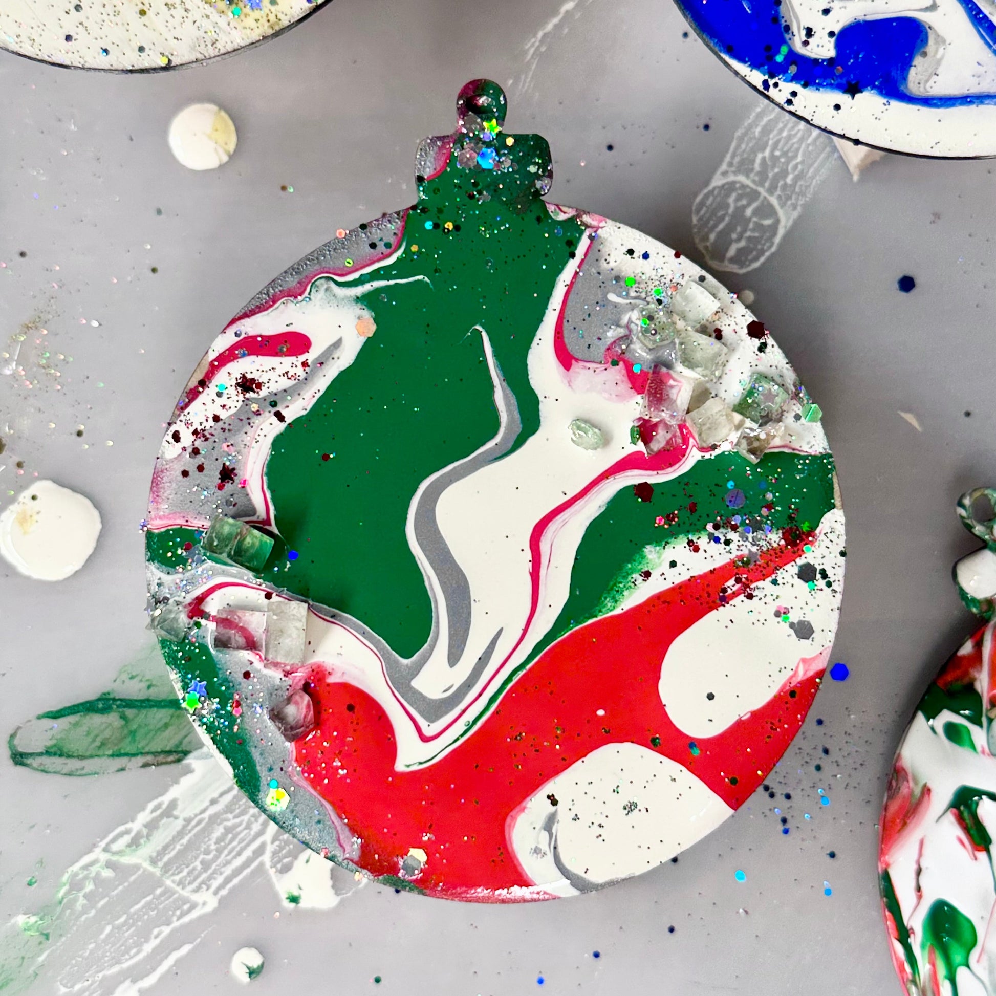 Colorful marbled wooden ornament on a gray surface