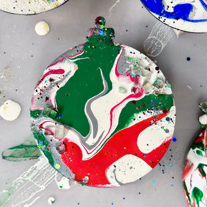 Colorful marbled wooden ornament on a gray surface