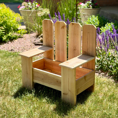 Wooden planter chair in a garden setting with flowers and plants.