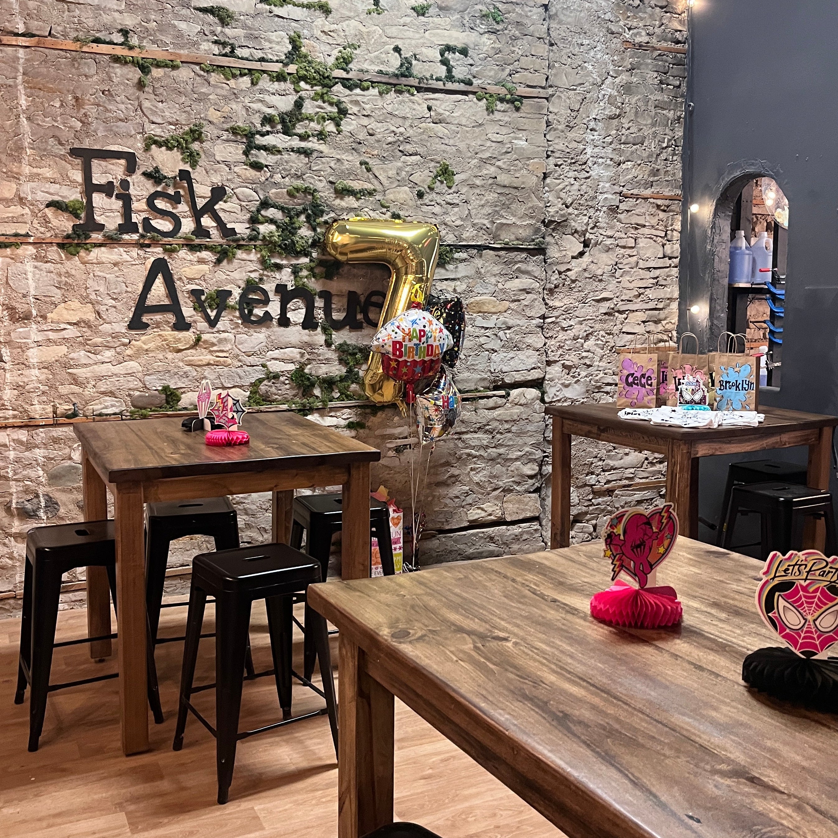 Private room with wooden tables and chairs in a casual setting.