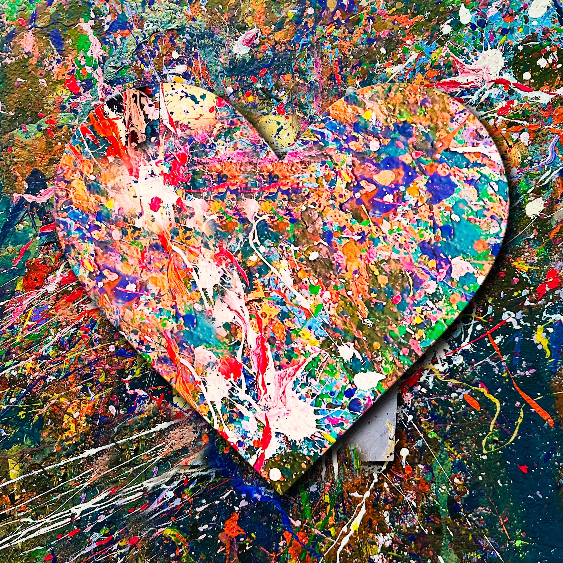 Abstract painting of a heart with multicolored splashes on a textured background