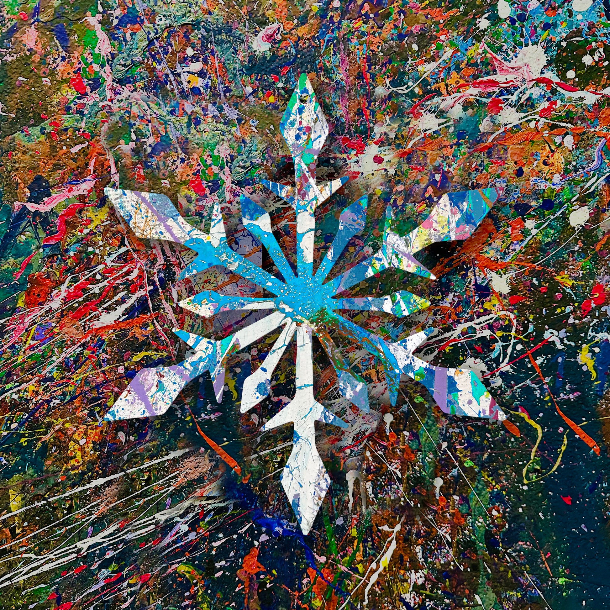 Splatter painted wooden snowflake craft on a colorful abstract wall in The Splatter Zone.