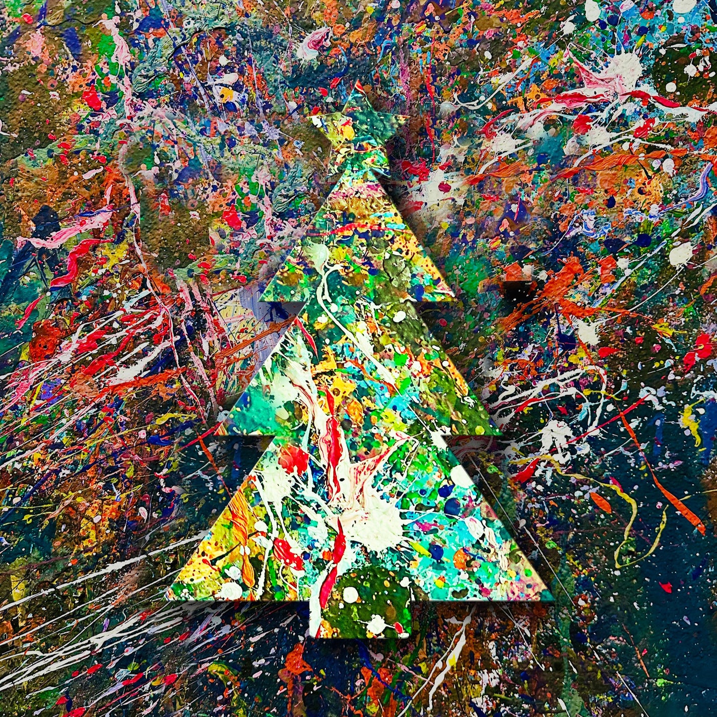 Wooden cutout of a splatter painted Christmas tree on a colorful wall.